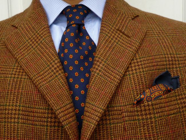 The tie and pocket square should harmonize, not match